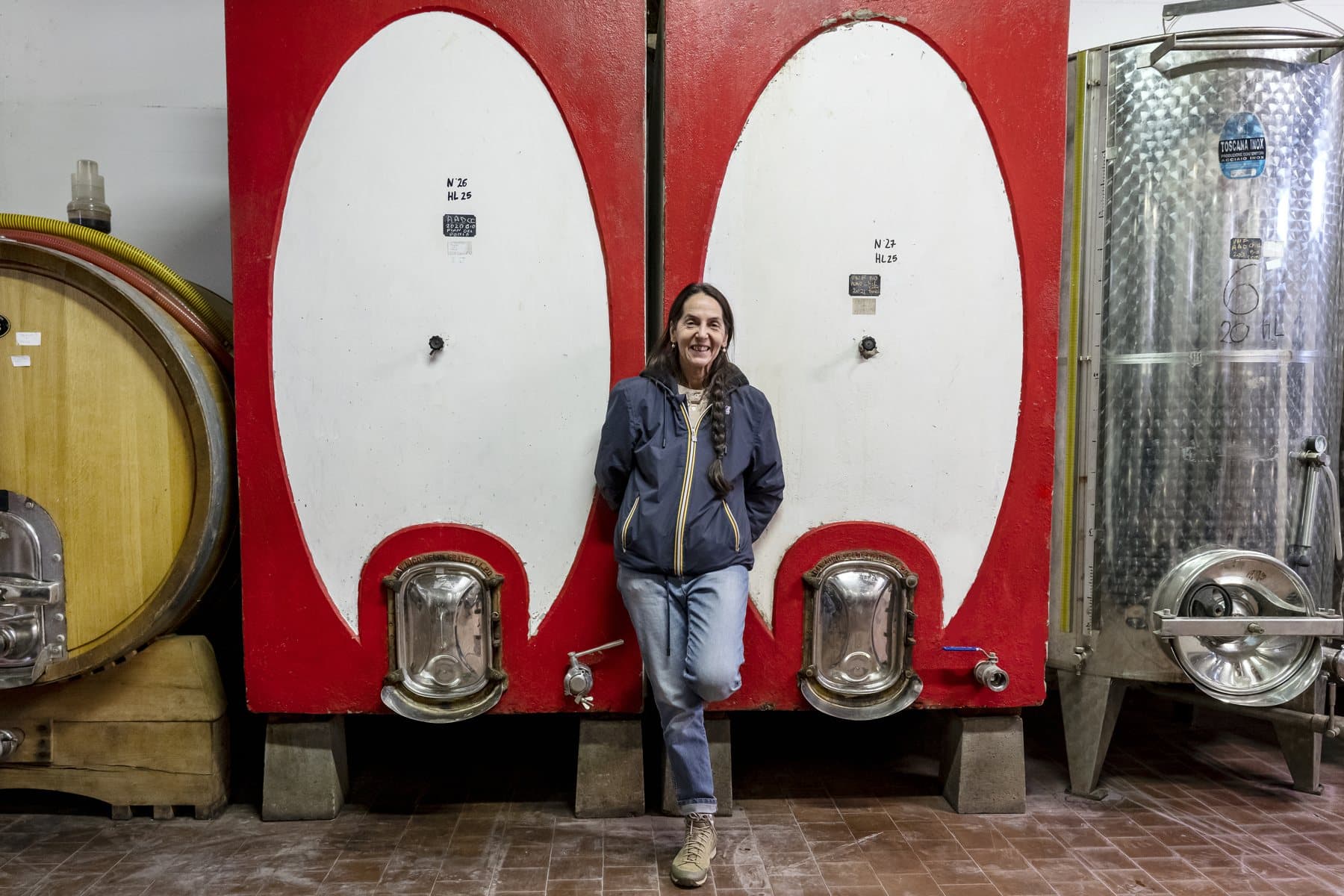 The red and white painted cement vats in the cellar at Casole